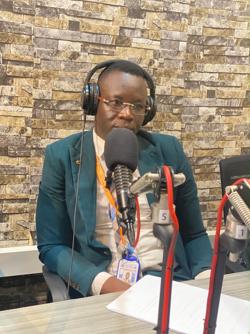 Advocate Emmanuel Sumagule Benaih Swaka seated at the studio microphone.