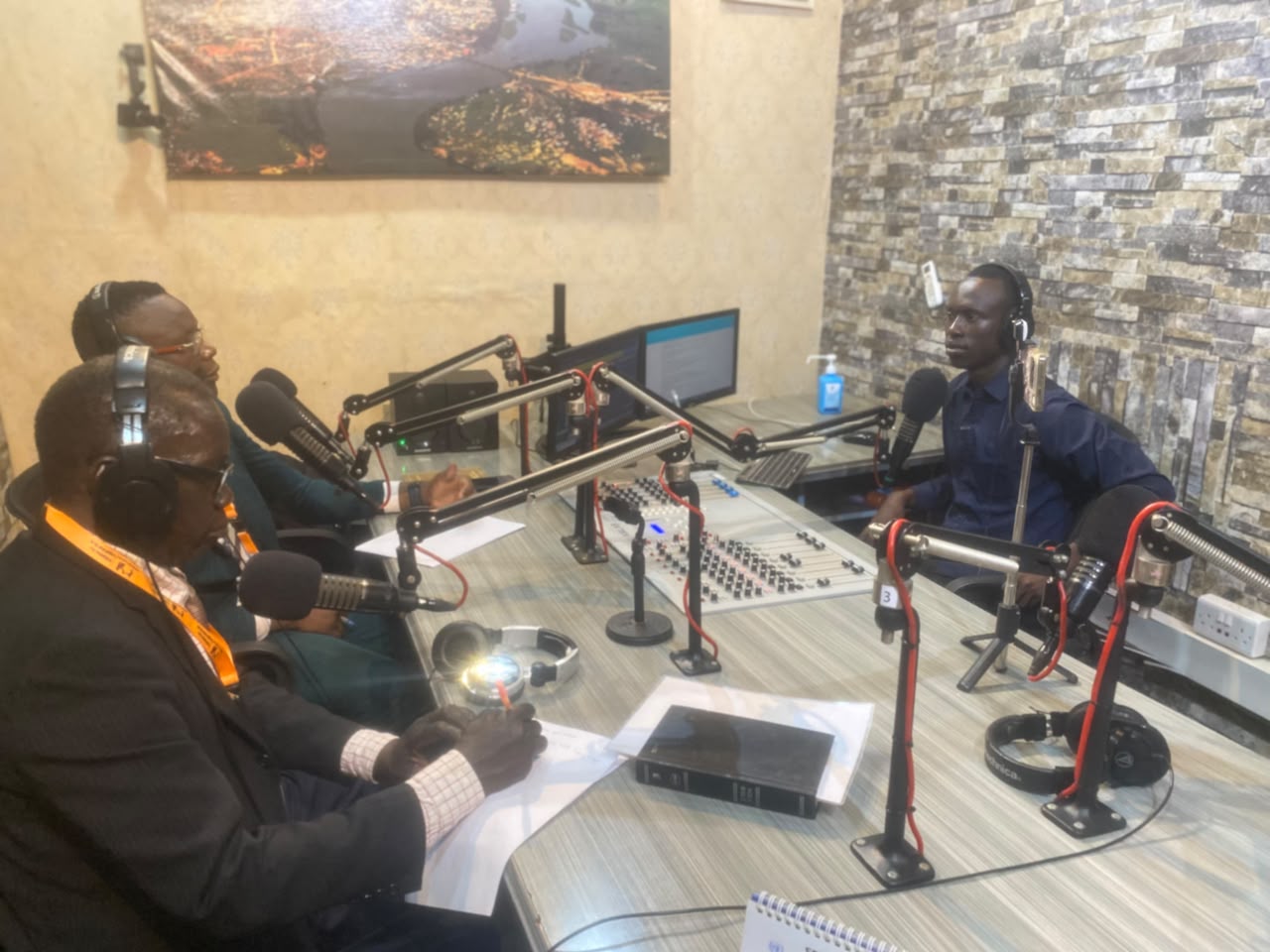 ILA representatives in the Favour FM radio studio during the talk show.
