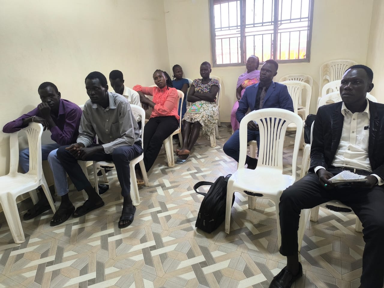 Community participants seated during an ILA legal awareness session.